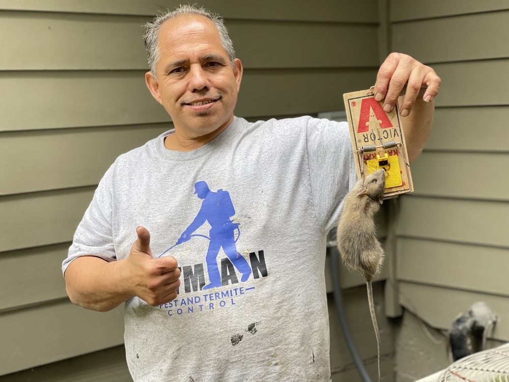 Gilbert from Ratman Pest Control giving a thumbs up after a successful rodent removal